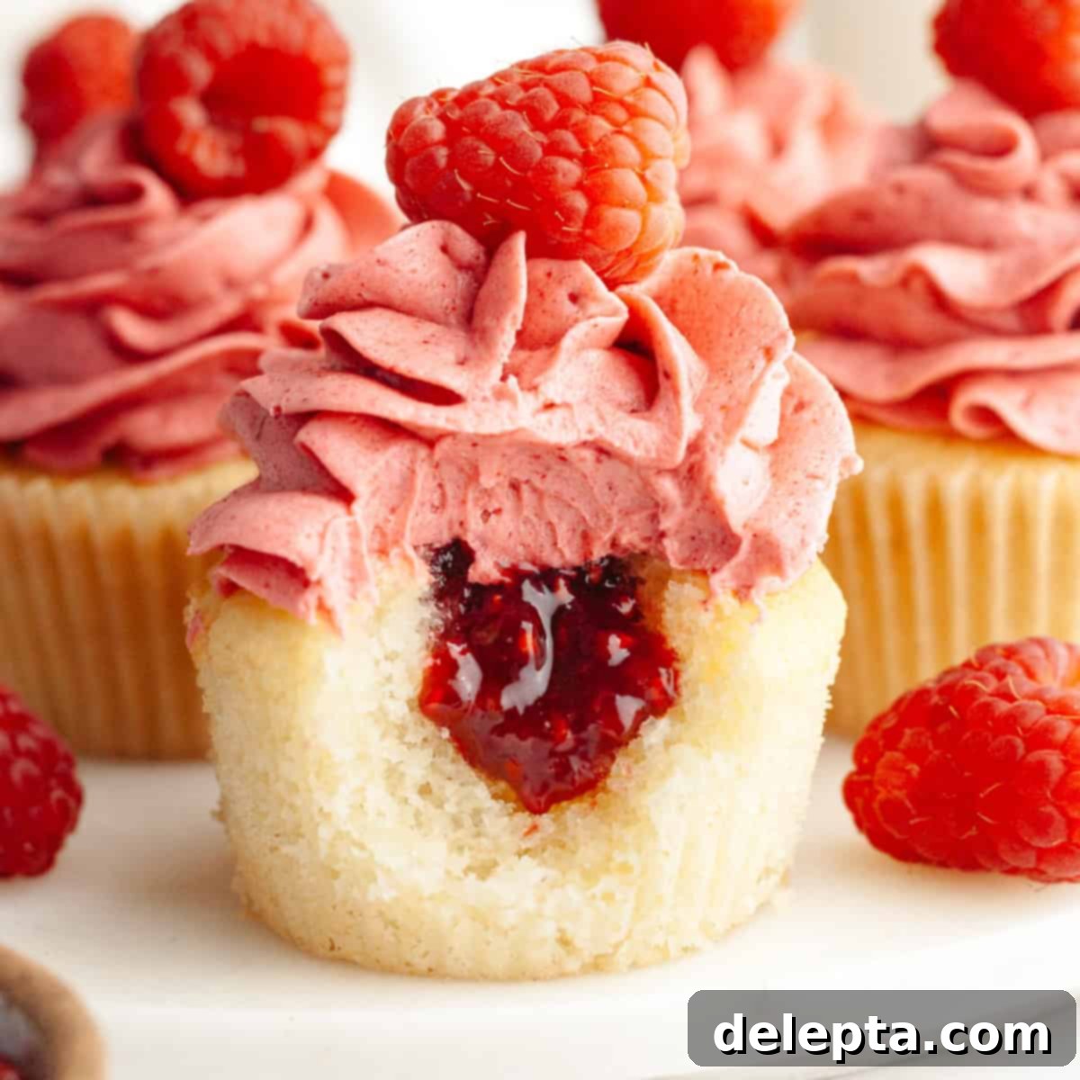 Raspberry Almond Jam Burst Cupcakes 1 featured 20184