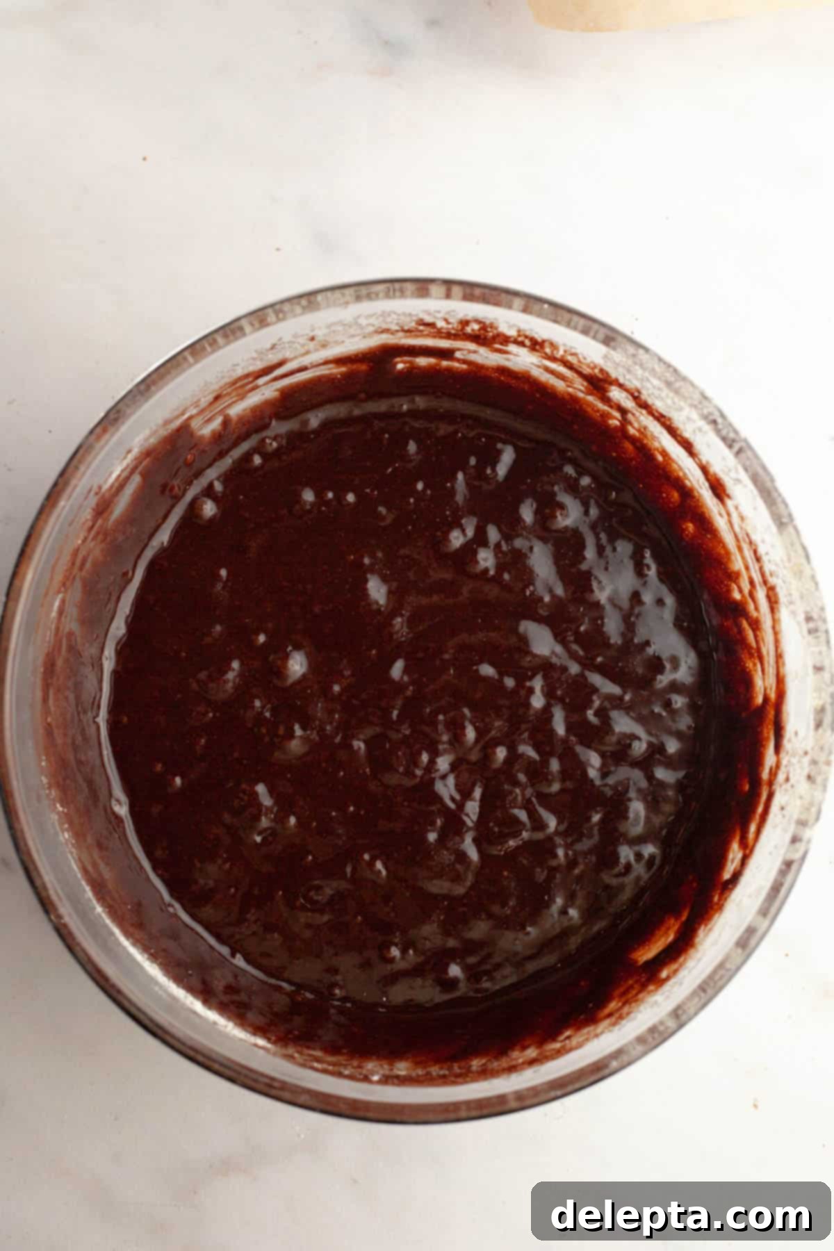 Rich Chocolate Brownies with Tangy Cream Cheese Frosting 6 The combined egg and chocolate mixtures, being whisked together for brownie batter.