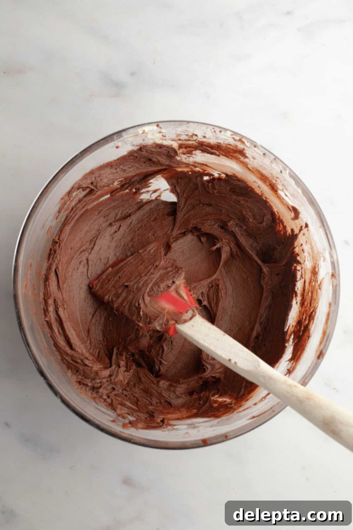 Rich Chocolate Brownies with Tangy Cream Cheese Frosting 8 Smooth, dark chocolate cream cheese frosting in a glass mixing bowl.