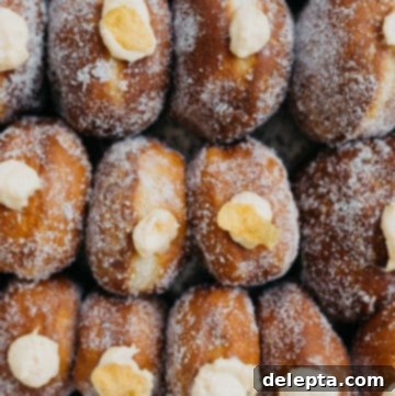 Breakfast Cereal Bliss 6 Delicious homemade cereal milk donuts with crunchy cornflakes on top, a unique sweet treat.