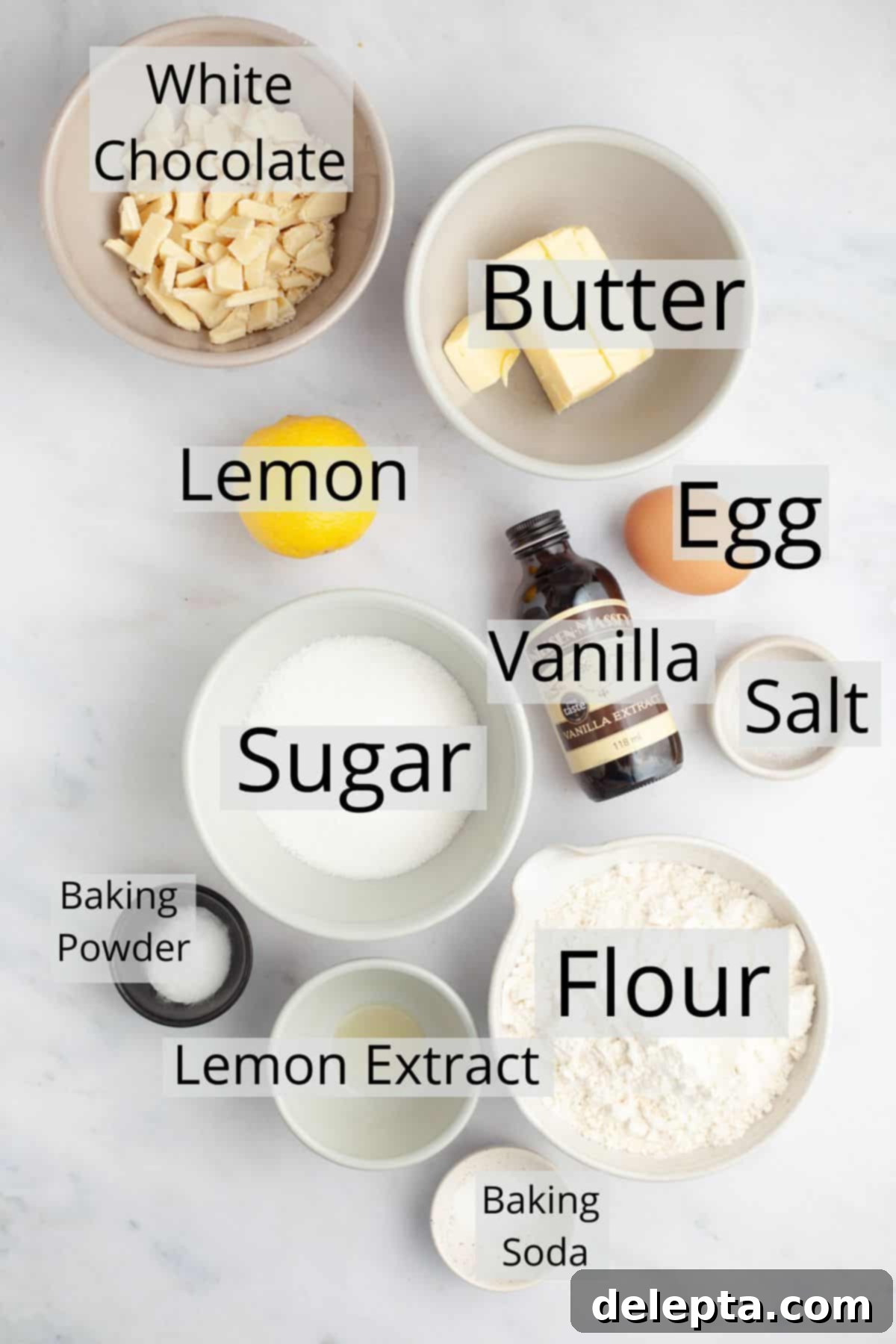 Sunshine Lemon White Chocolate Delights 3 All the pre-measured ingredients laid out in small bowls for making lemon white chocolate cookies, including flour, sugar, butter, eggs, lemon, and white chocolate.