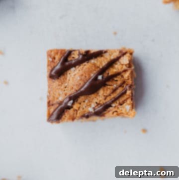 Java Peanut Butter Crunch Blondies 6 A close up of a coffee peanut butter crunch blondie with mocha drizzle
