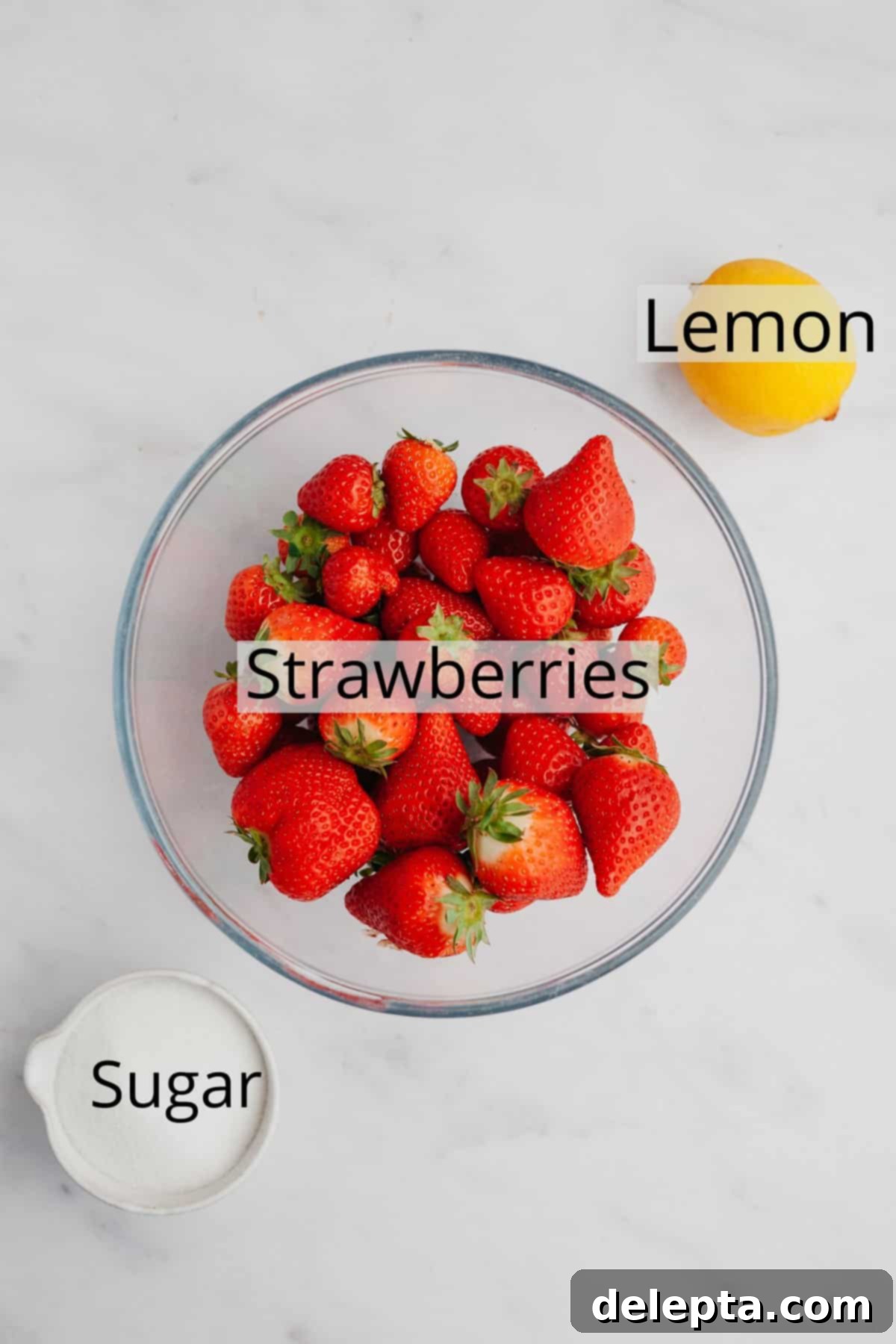 Easy 3 Ingredient Strawberry Cake Filling 3 All the fresh ingredients meticulously weighed out into small bowls, ready to make a delicious strawberry filling for cake.