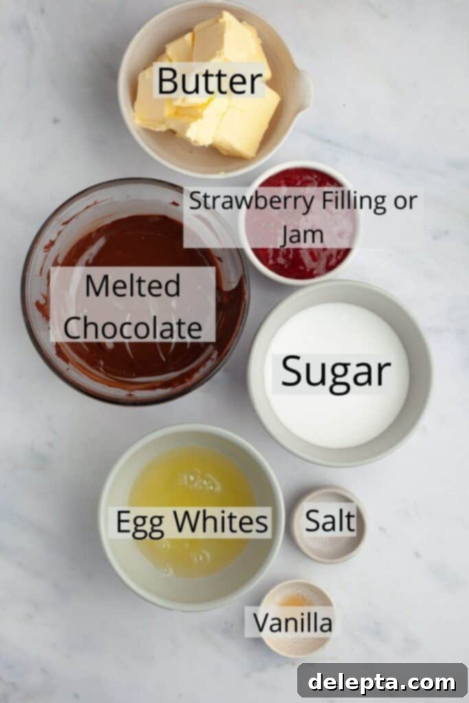 Decadent Chocolate Strawberry Cake 4 Ingredients for chocolate Swiss meringue buttercream including butter, egg whites, sugar, and melted chocolate.