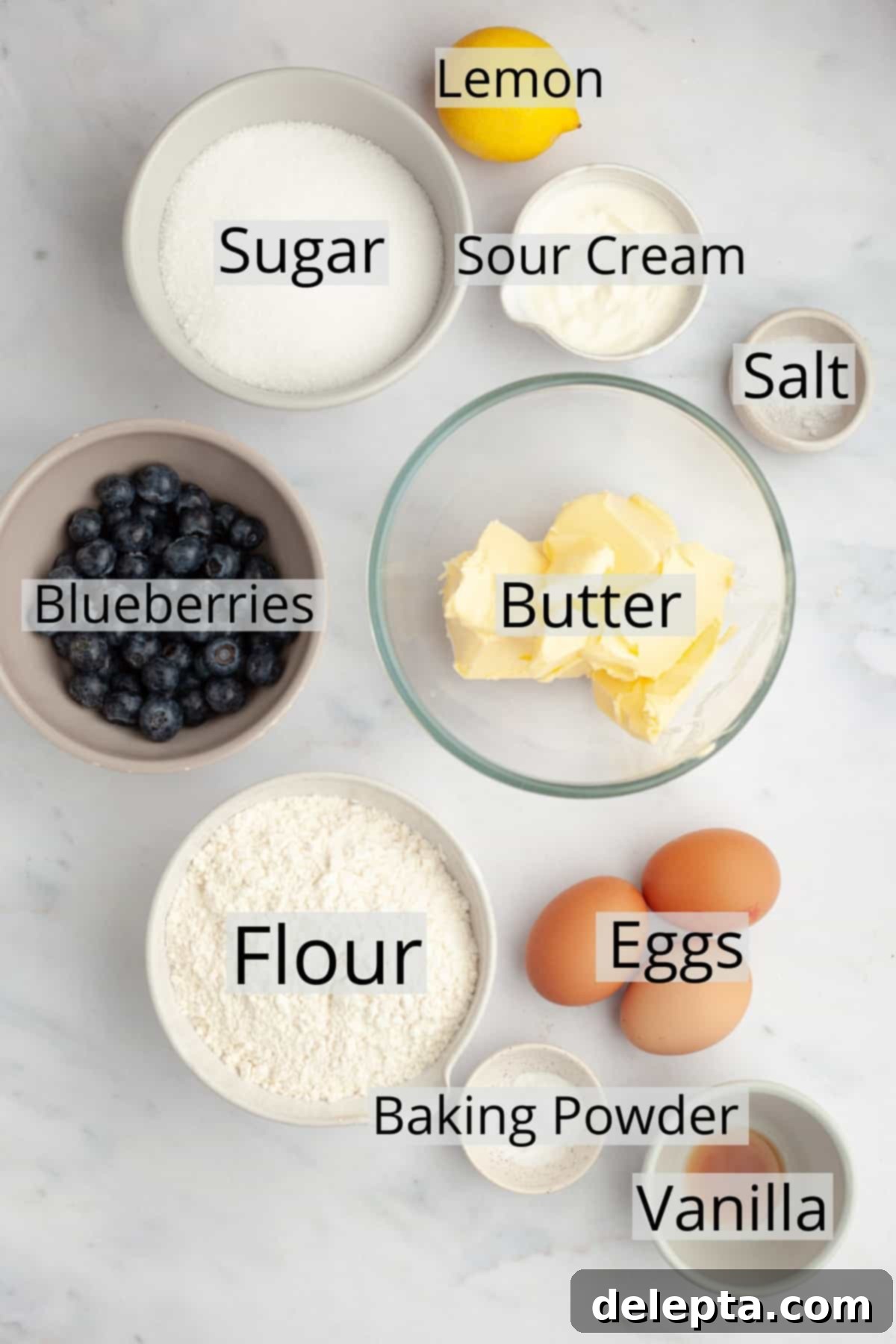 Heavenly Blueberry Pound Cake 3 All the pre-measured ingredients laid out in small bowls, ready for making blueberry loaf cake.