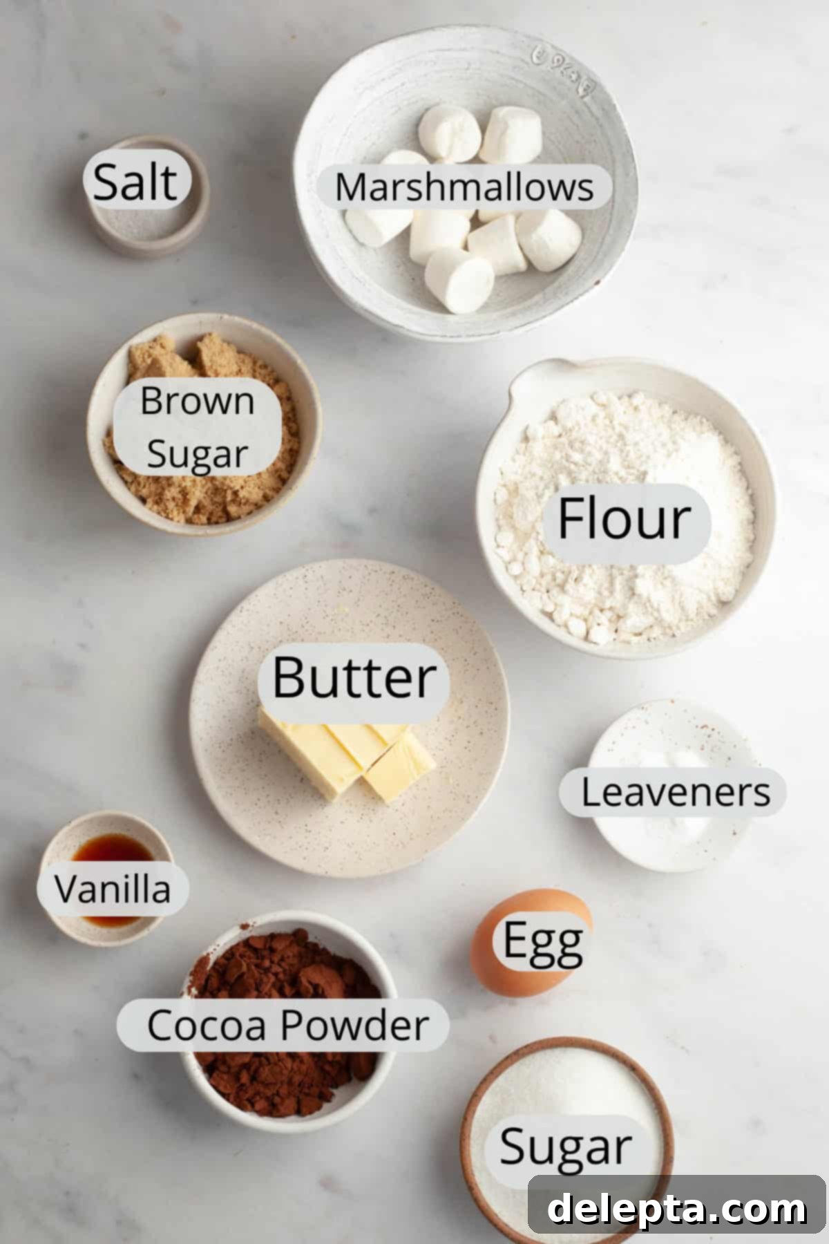 Gooey Chocolate Marshmallow Cookies 3 Bowls of pre-measured ingredients like flour, cocoa powder, sugars, and marshmallows, ready for making chocolate marshmallow cookies.