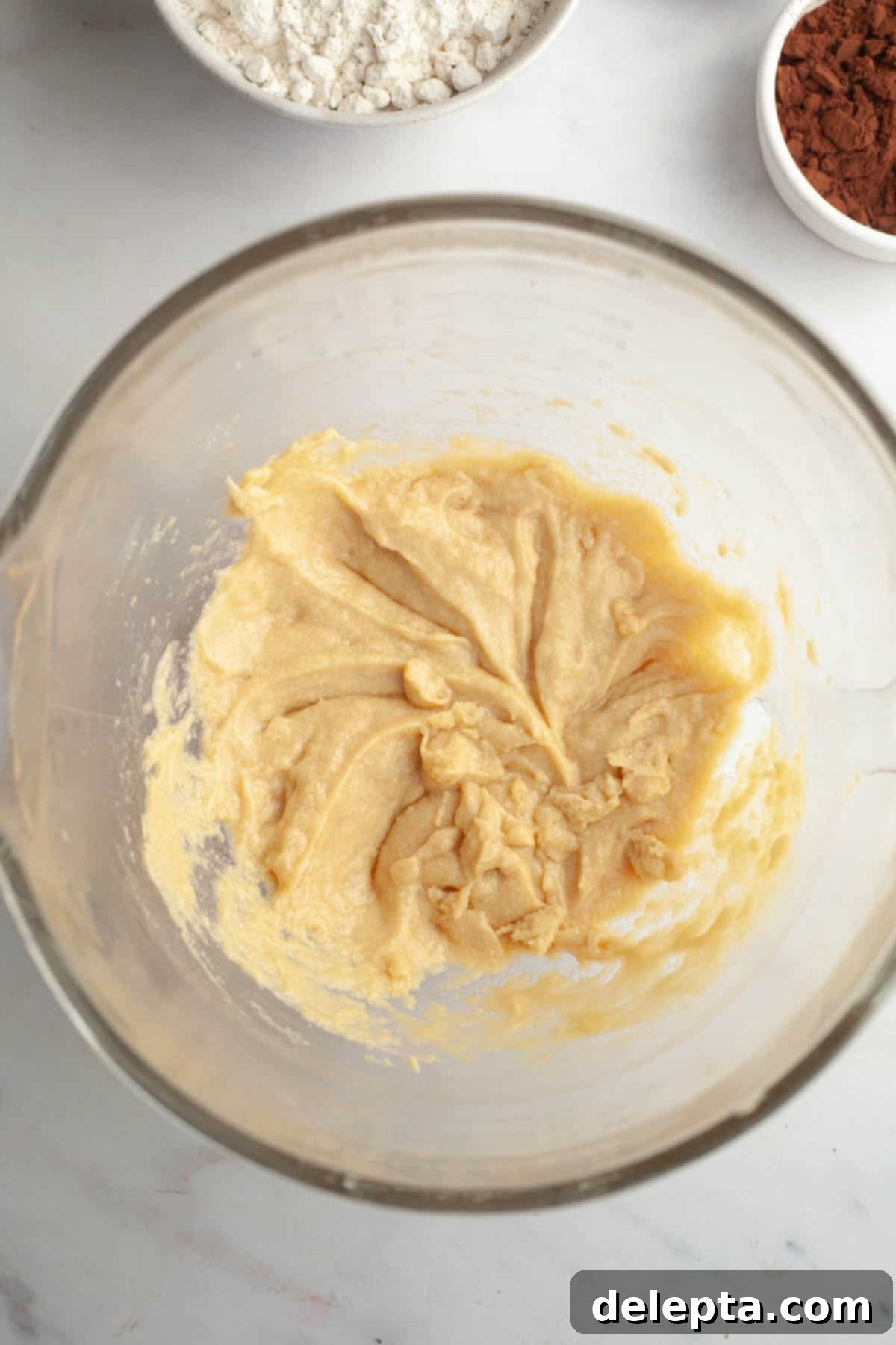 Gooey Chocolate Marshmallow Cookies 5 Creamed butter and sugar mixture after adding egg and vanilla, showing a well-combined, lighter color.