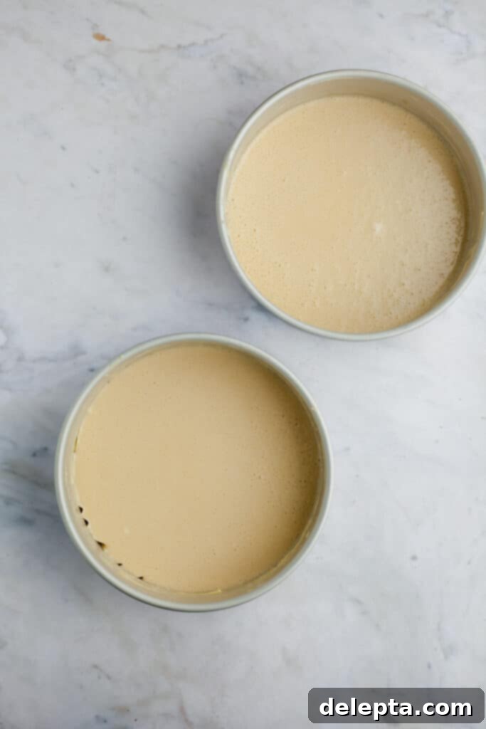 Ultimate Tiramisu Layer Cake 10 two cake pans with unbaked cake batter