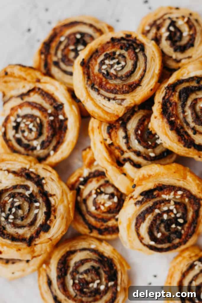 Golden Tapenade Spirals 2 sesame and tapenade pinwheels