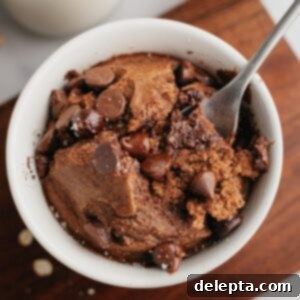 Decadent Chocolate Baked Oats 6 Chocolate baked oats in a small white dish.