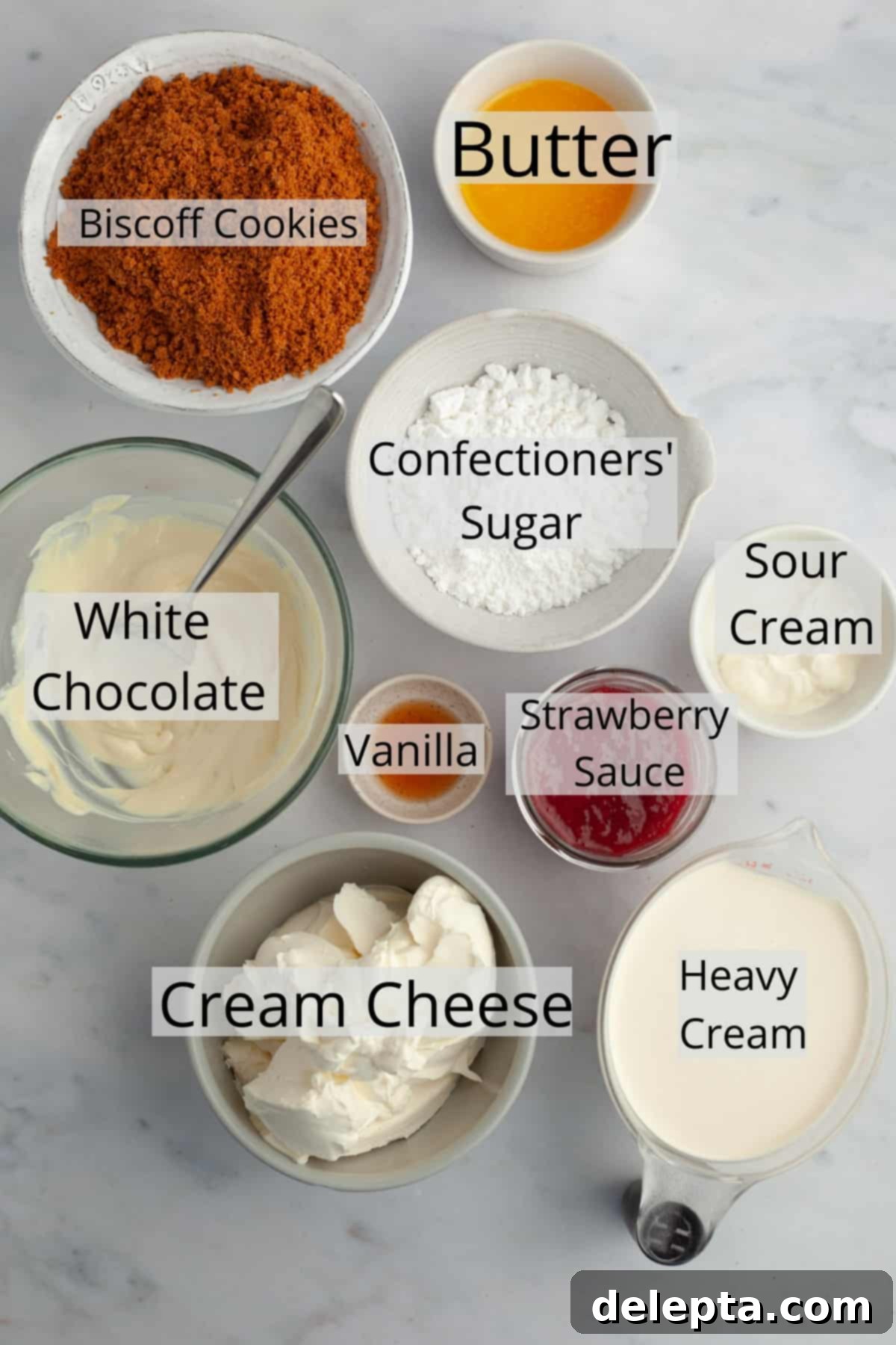 Effortless No Bake Strawberry White Chocolate Cheesecake 3 All the ingredients needed to make strawberry white chocolate cheesecake, weighed out into small bowls, ready for preparation.