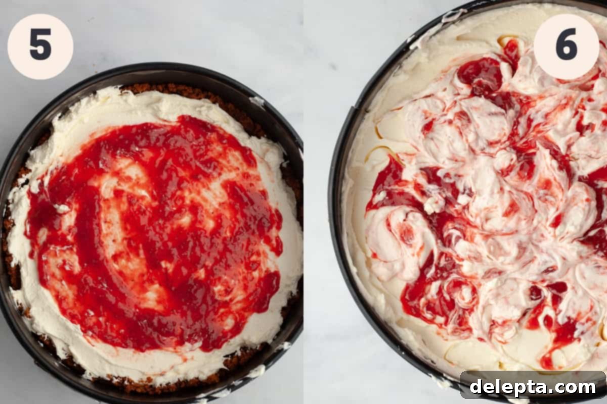 Effortless No Bake Strawberry White Chocolate Cheesecake 6 A cheesecake pan filled with the strawberry and white chocolate cheesecake layers, showing the swirl effect.