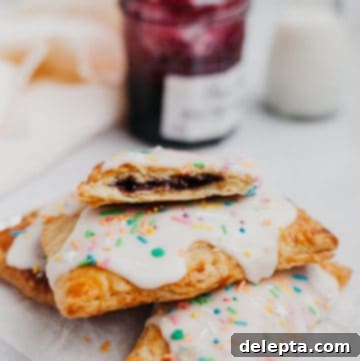Artisan Blueberry Toaster Treats 6 a stack of blueberry pop tarts with a jam jar behind
