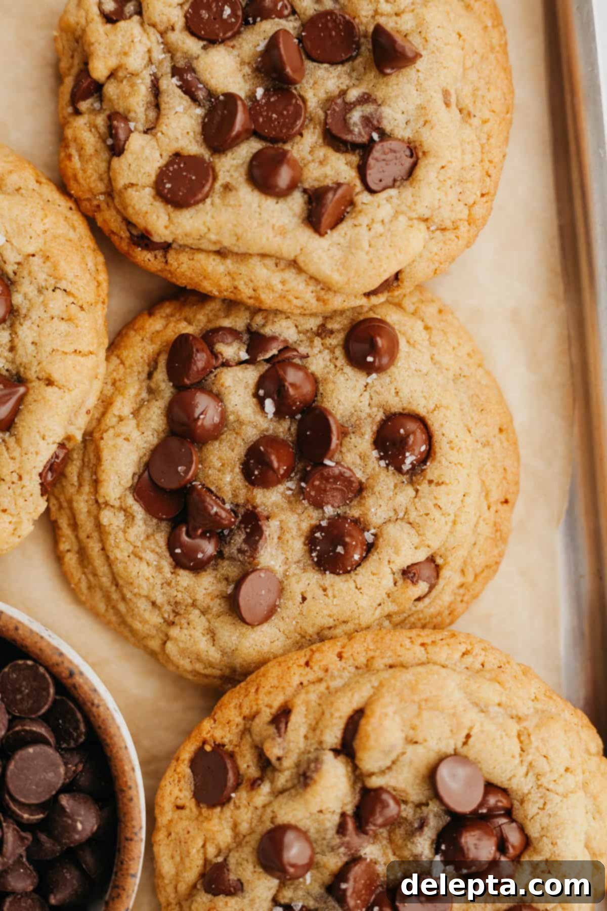 Six Easy Small Batch Chocolate Chip Cookies 7 Several chocolate chip cookies on a cookie sheet.