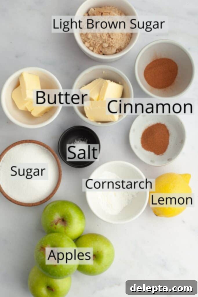 Apple Pie Stuffed Cinnamon Rolls 4 All the fresh and wet ingredients needed to make an apple pie filling, weighed out into small bowls, including diced apples, butter, sugar, and spices.