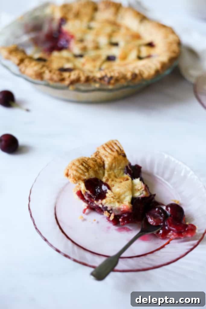 Luscious Homemade Kirsch and Vanilla Cherry Pie 4 Baked kirsch cherry pie with a decorative lattice crust
