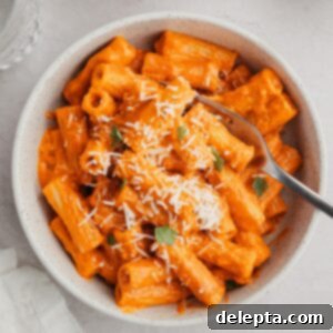 Viral Easy Spicy Vodka Pasta 9 Spicy vodka pasta in a small white bowl.