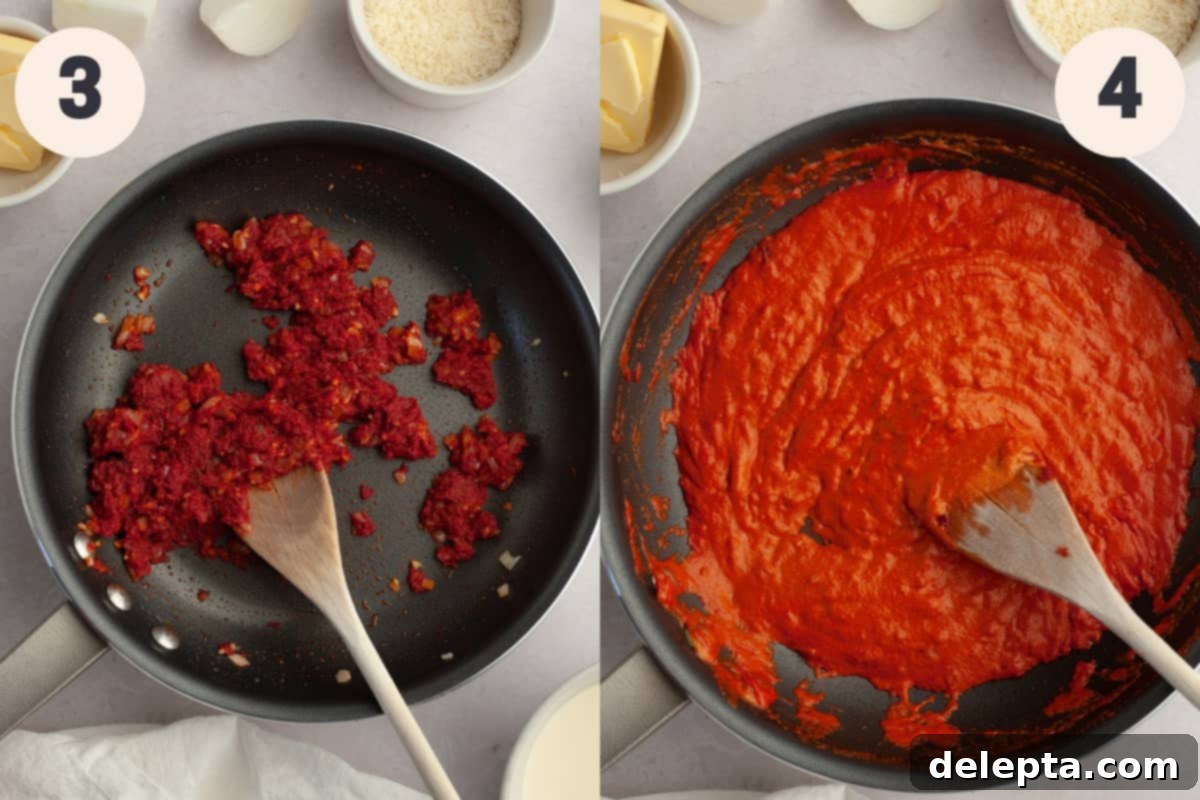 Viral Easy Spicy Vodka Pasta 5 A saucepan with tomato puree and tomato sauce in it.