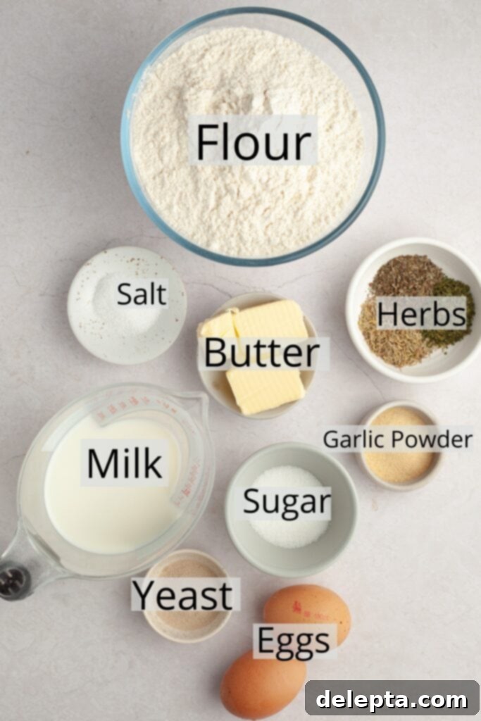 Irresistibly Soft and Fluffy Garlic Dinner Rolls 3 All the ingredients needed to make garlic dinner rolls, weighed out into small bowls, including flour, milk, sugar, yeast, butter, eggs, and various dried herbs and garlic powder.