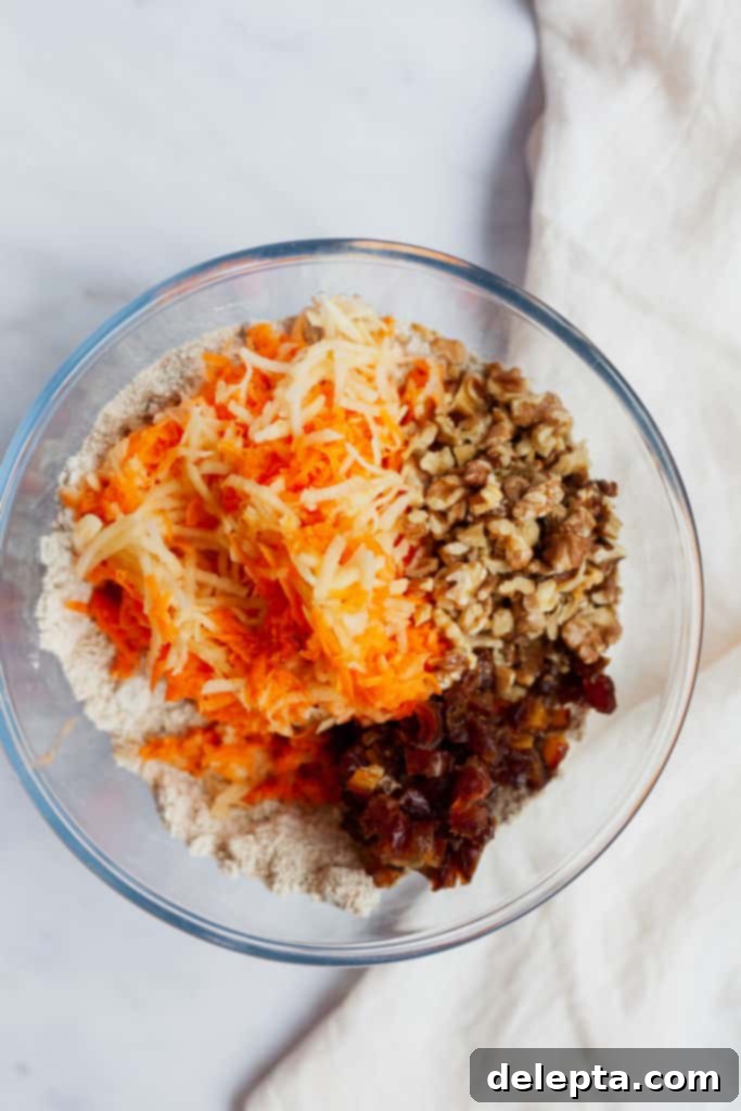 Sunshine Morning Glory Apple and Carrot Muffins 3 overhead view of shredded carrot, apple, date and walnuts in a bowl
