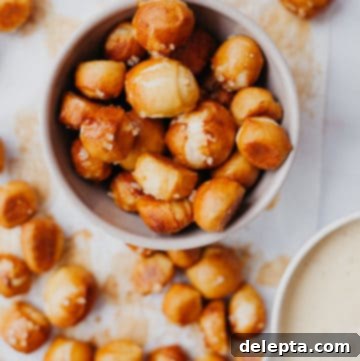 Irresistible Pretzel Bites and Cheesy Dip 8 Overhead view of pretzel bites in a bowl, and a bowl of cheese sauce