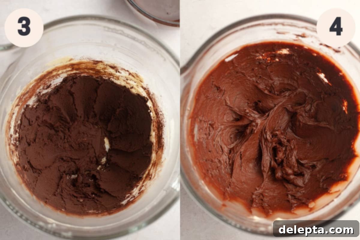 Fudgy Chocolate Frosting The Sour Cream Secret 5 A large glass bowl filled with rich, creamy chocolate frosting, indicating the completed mixing process.