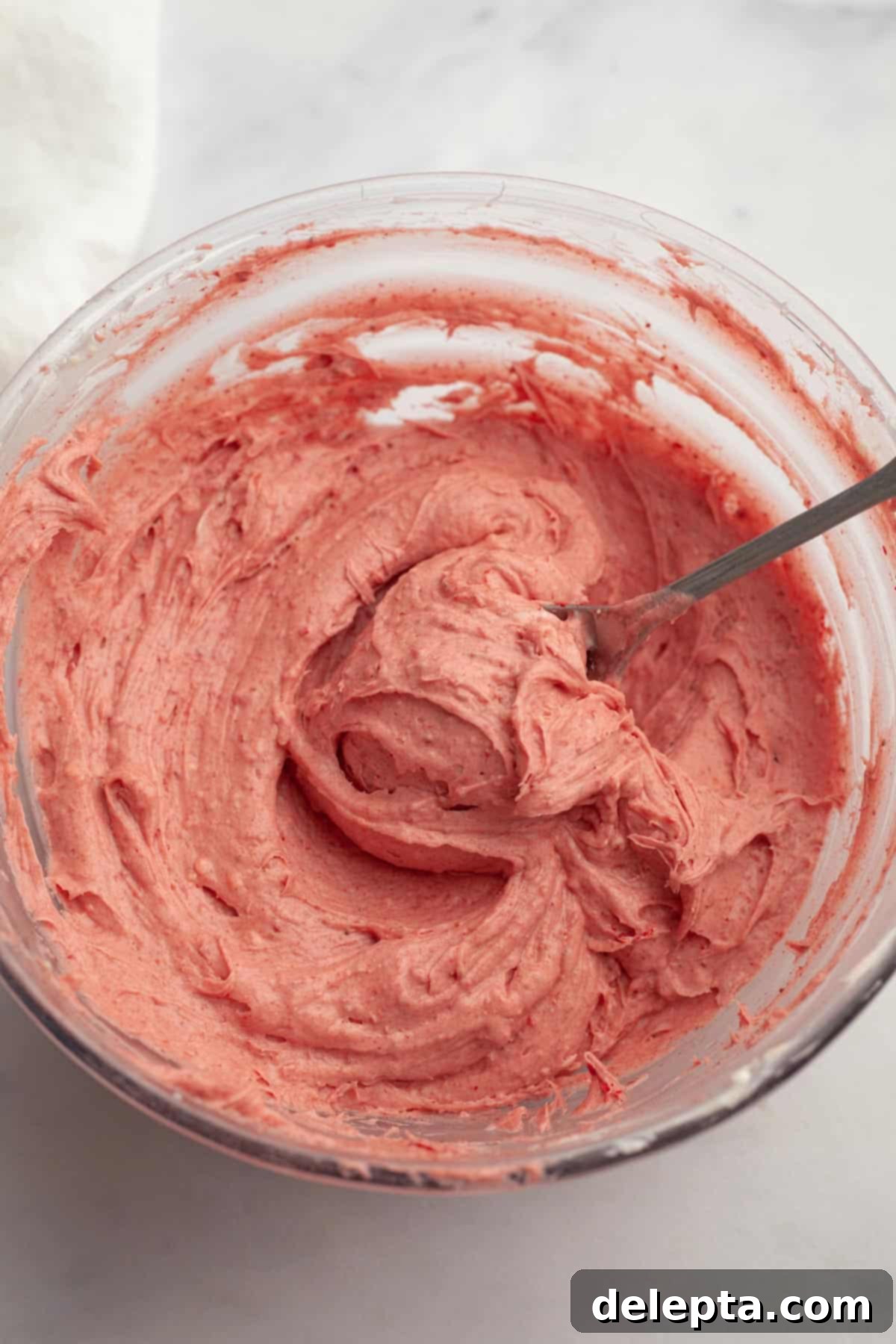 Dreamy Strawberry Cream Cheese Frosting 2 Strawberry cream cheese frosting in a bowl.