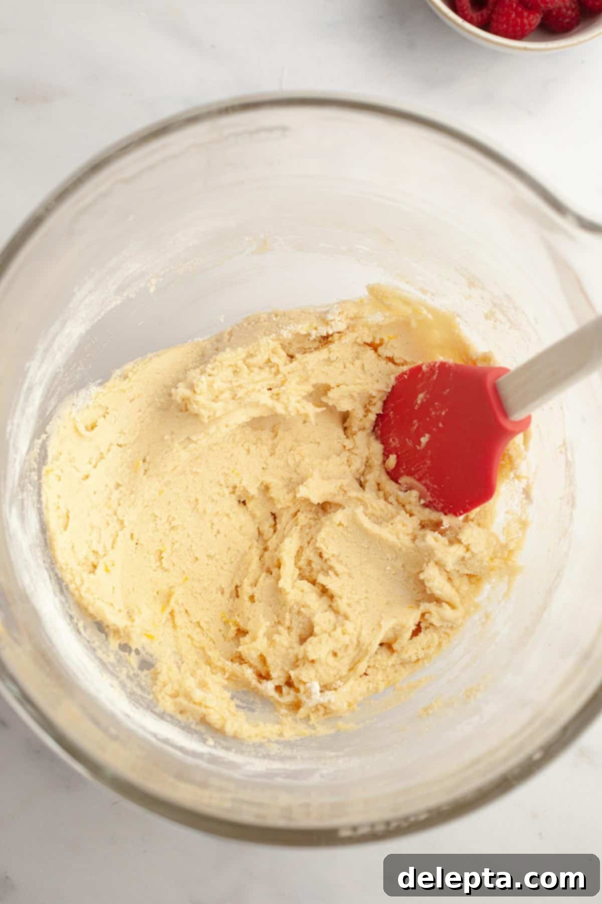 Easy One Bowl Lemon Raspberry Cookies 7 Lemon cookie batter in a bowl after dry ingredients have been added.