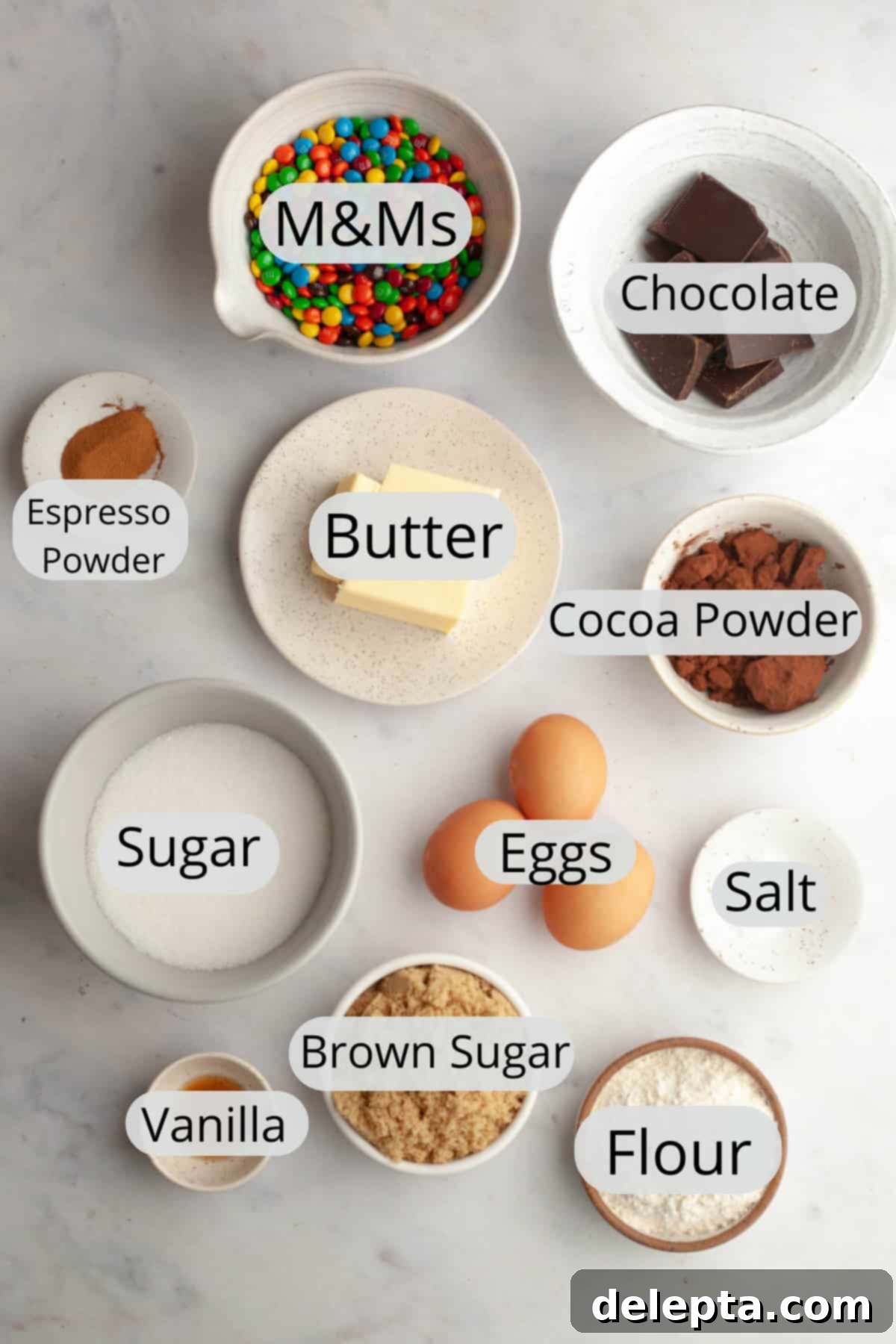 Fudgy M and M Brownies 3 All the ingredients needed to make M&M brownies, weighed out into small bowls.