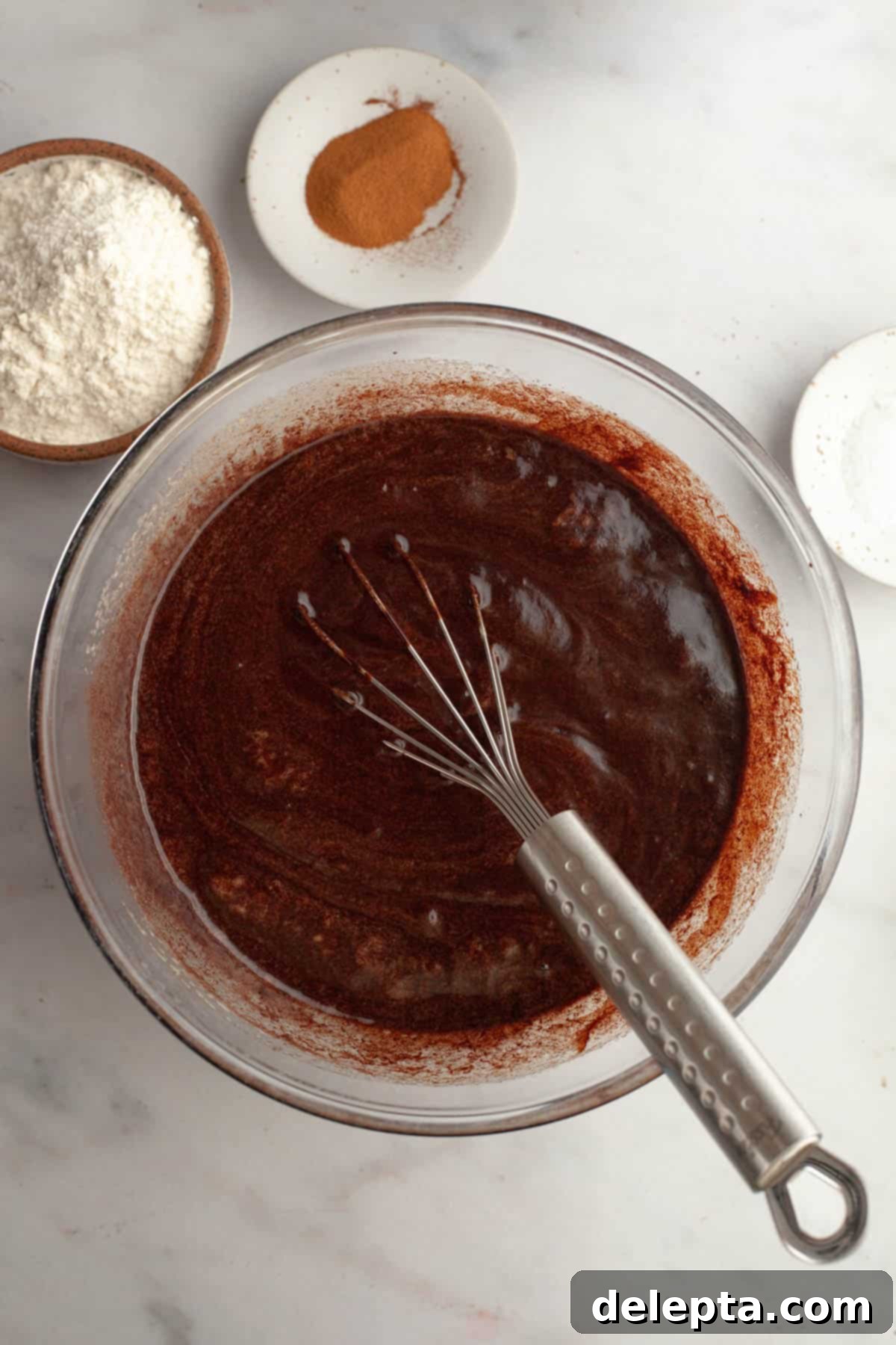 Fudgy M and M Brownies 7 Brownie batter in a glass bowl.