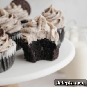 Decadent Chocolate Oreo Delights 10 Chocolate cupcakes covered in Oreo frosting, garnished with extra Oreo pieces.