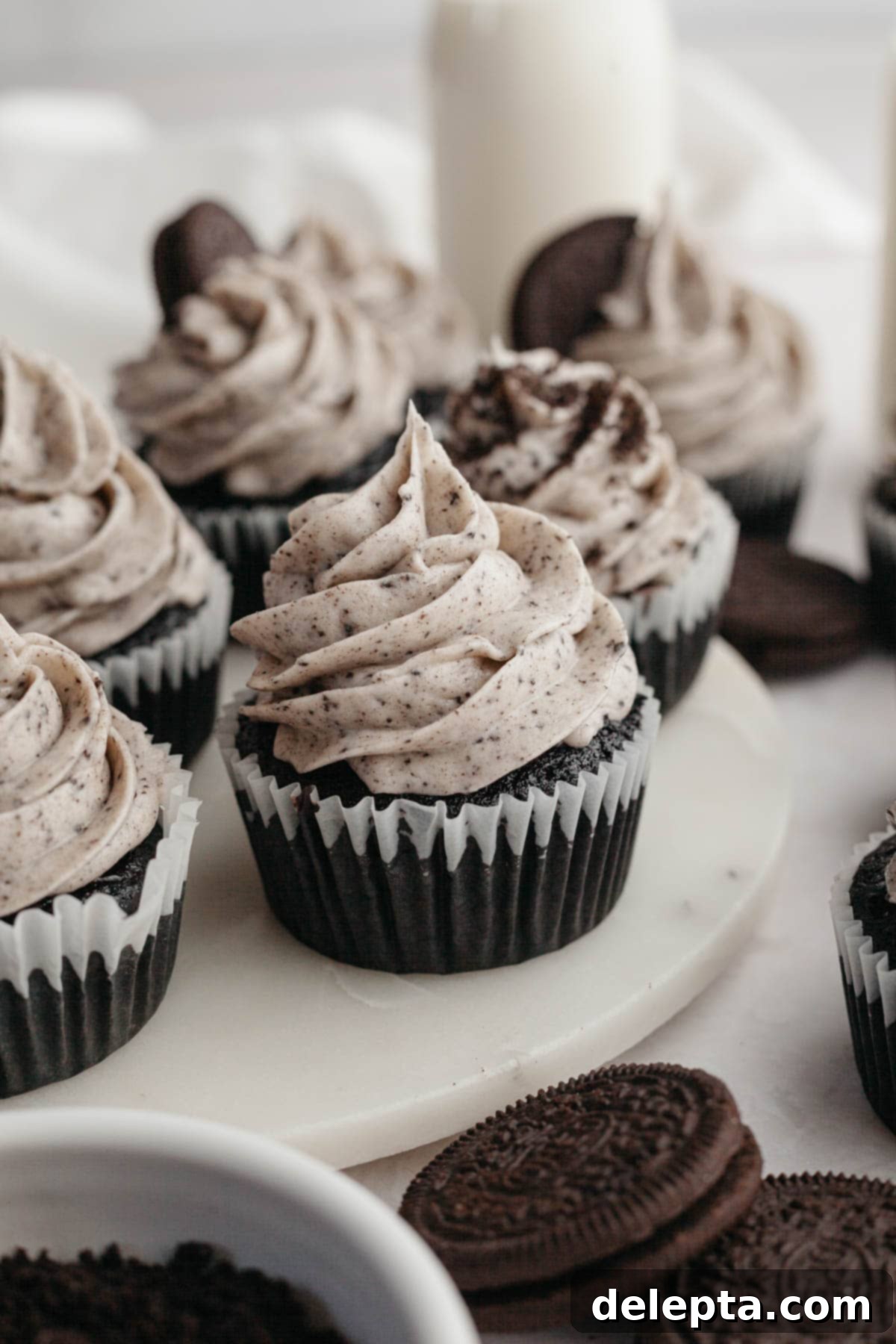Decadent Chocolate Oreo Delights 8 Chocolate cupcakes covered in Oreo frosting, perfectly piped and ready to eat.