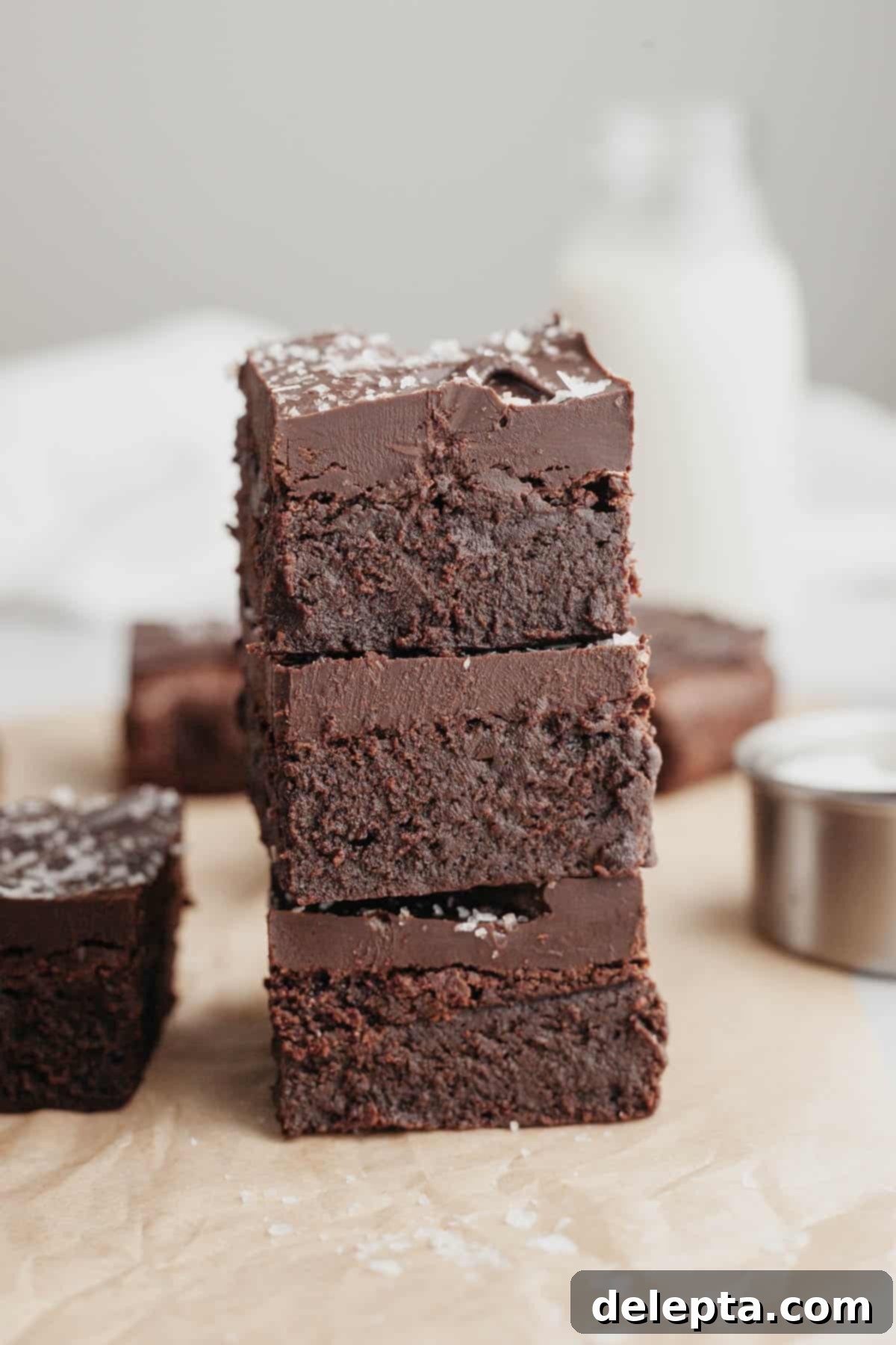 Decadent Fudgy Brownies with Velvety Chocolate Ganache 8 Fudgy brownies with chocolate ganache cut into squares and stacked