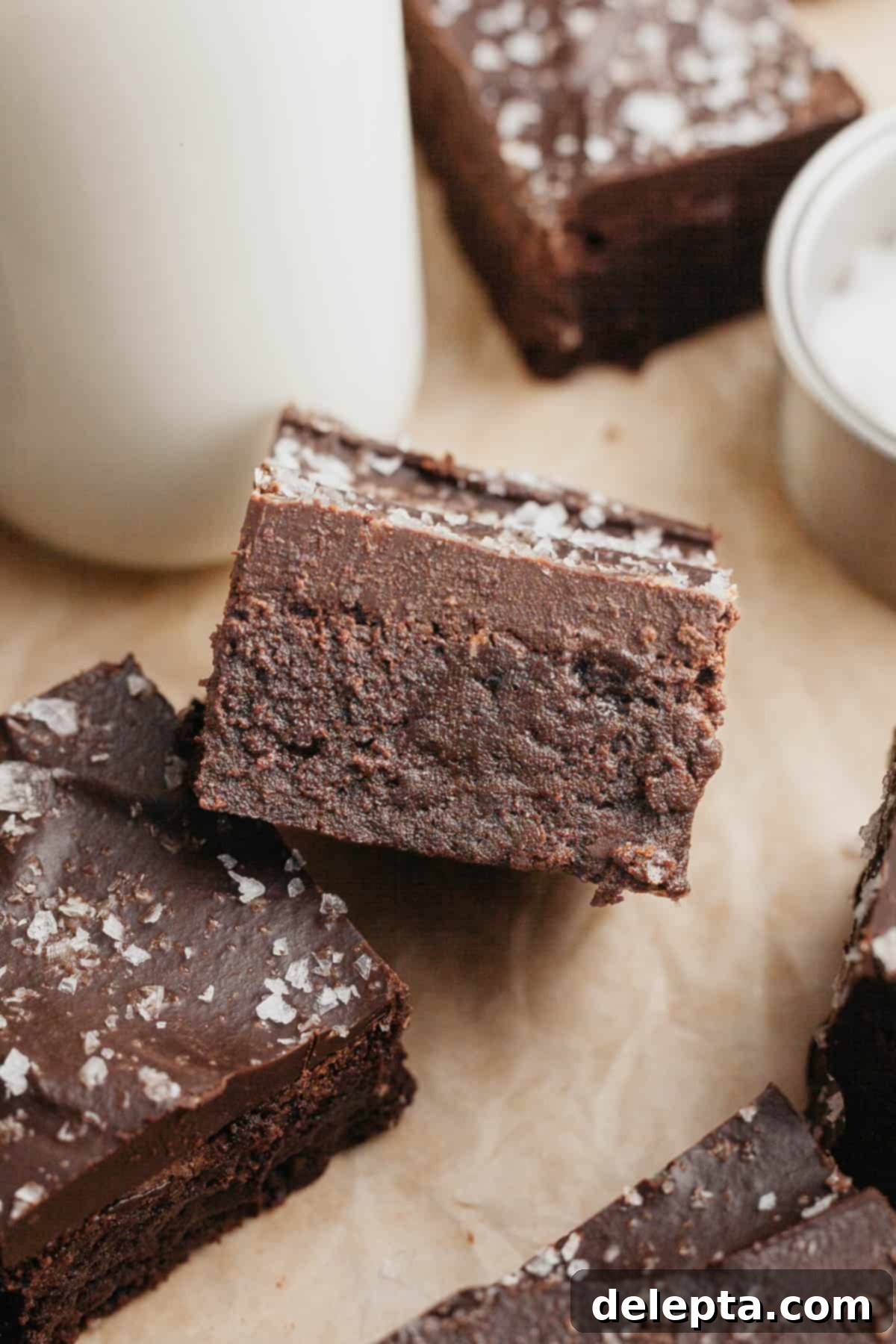 Decadent Fudgy Brownies with Velvety Chocolate Ganache 9 Fudgy brownies with chocolate ganache and sea salt on a cooling rack