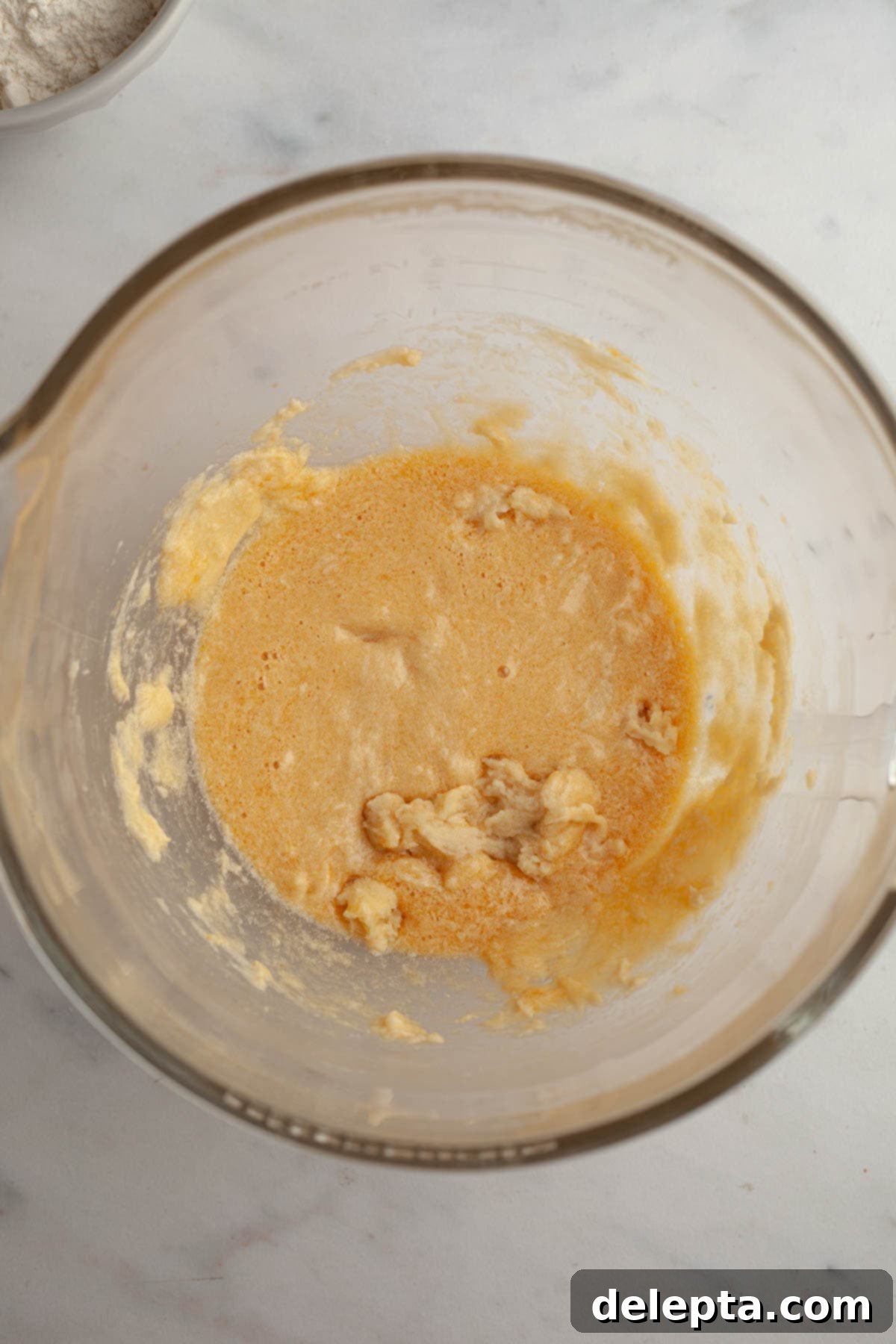 Galaxy Brownie Cookies 4 A mixing bowl showing a light, fluffy mixture of butter and sugars after creaming.