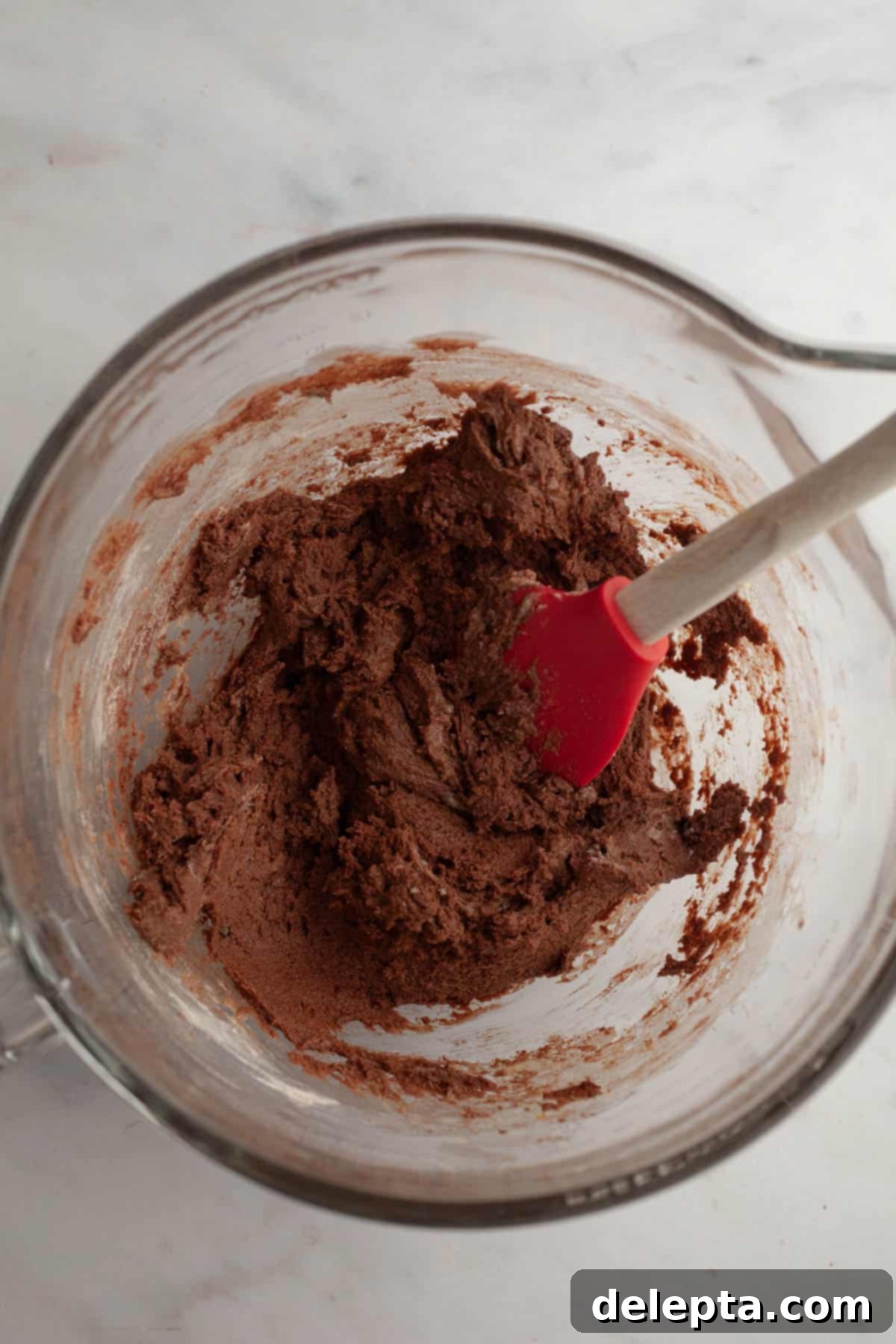 Galaxy Brownie Cookies 5 A mixing bowl filled with rich chocolate cookie dough, just combined.