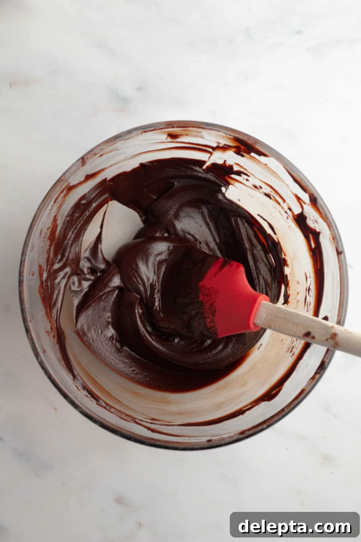 Galaxy Brownie Cookies 9 A large bowl showcasing perfectly smooth, glossy chocolate ganache after stirring.