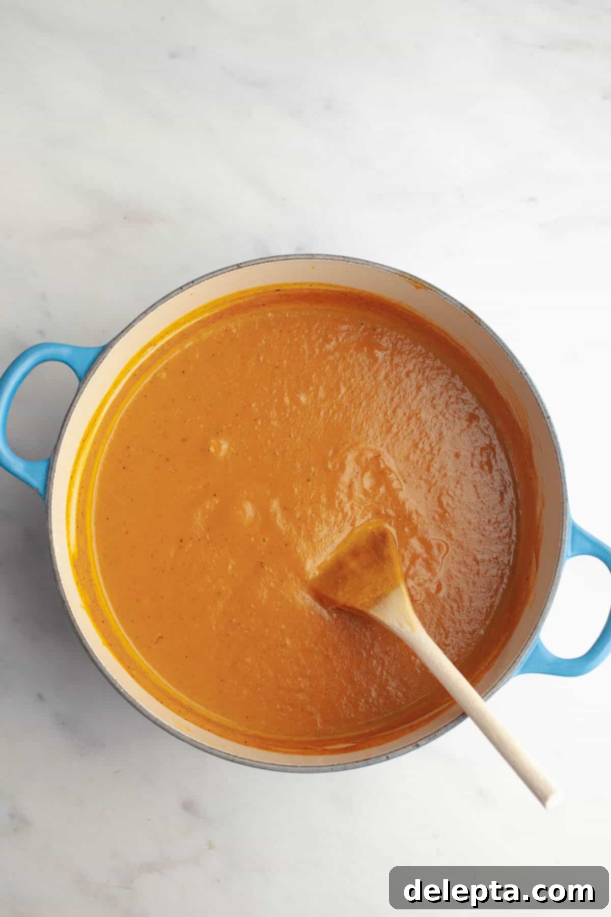 Warm Roasted Butternut & Carrot Ginger Soup 9 Roasted carrot and butternut squash soup in a large pot.
