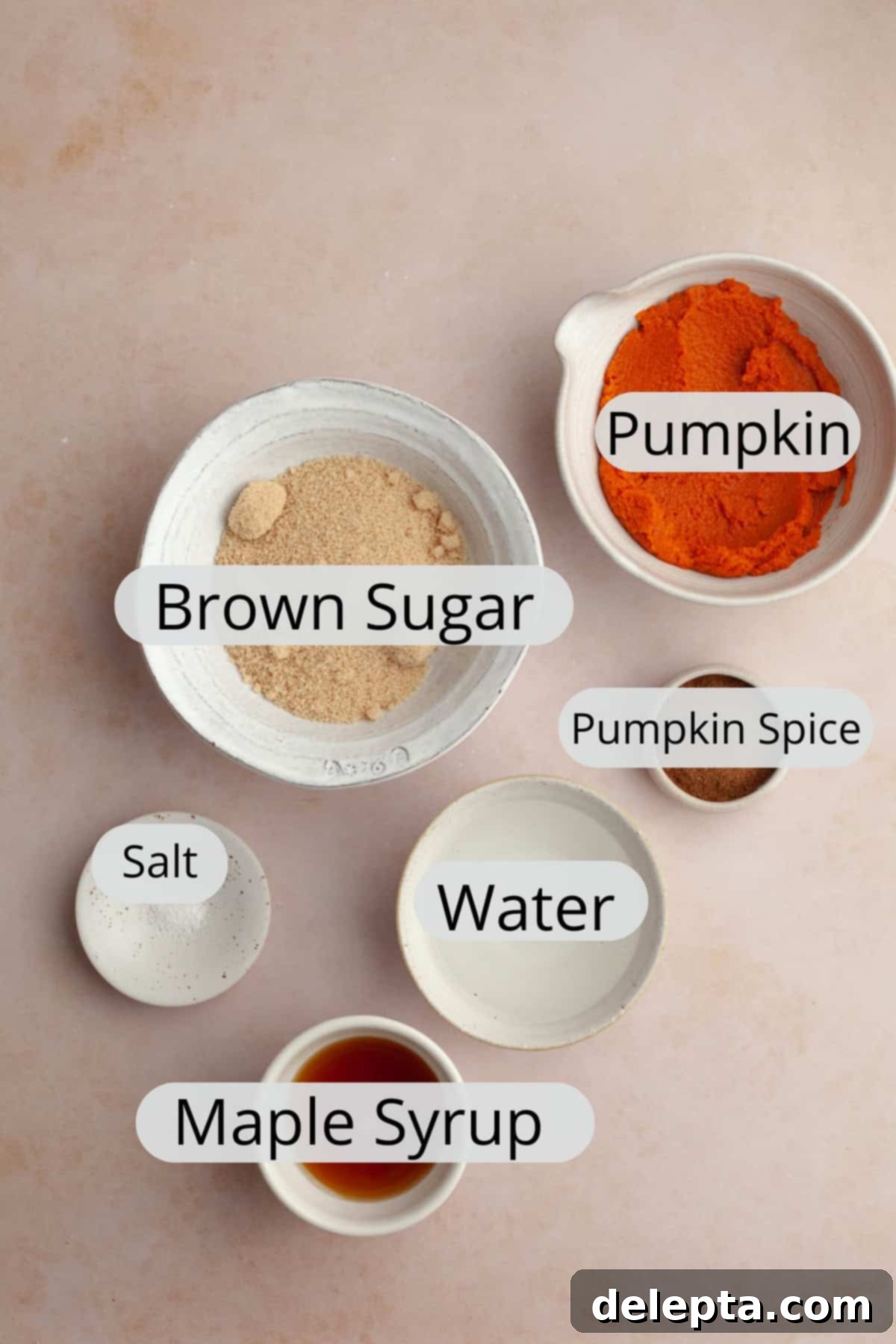 Easy Homemade Pumpkin Spice Syrup 3 All the essential ingredients for homemade pumpkin coffee sauce, neatly arranged in small bowls.