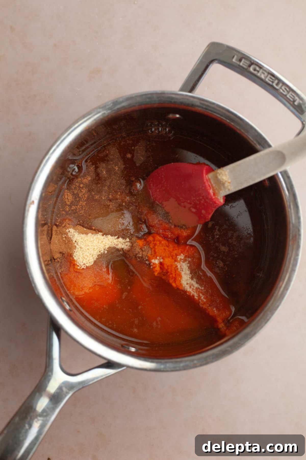 Easy Homemade Pumpkin Spice Syrup 4 All the ingredients for pumpkin coffee sauce combined in a small saucepan, ready to cook.