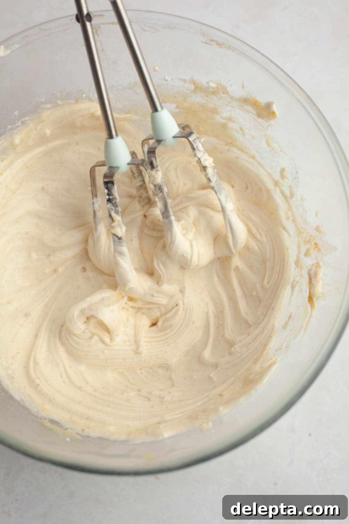 Rich Brown Butter Cinnamon Rolls with Velvety Brown Butter Frosting 13 Brown butter cream cheese frosting in a glass bowl.