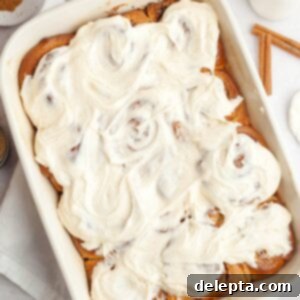 Rich Brown Butter Cinnamon Rolls with Velvety Brown Butter Frosting 16 Brown butter cinnamon rolls covered with brown butter frosting in a white dish.
