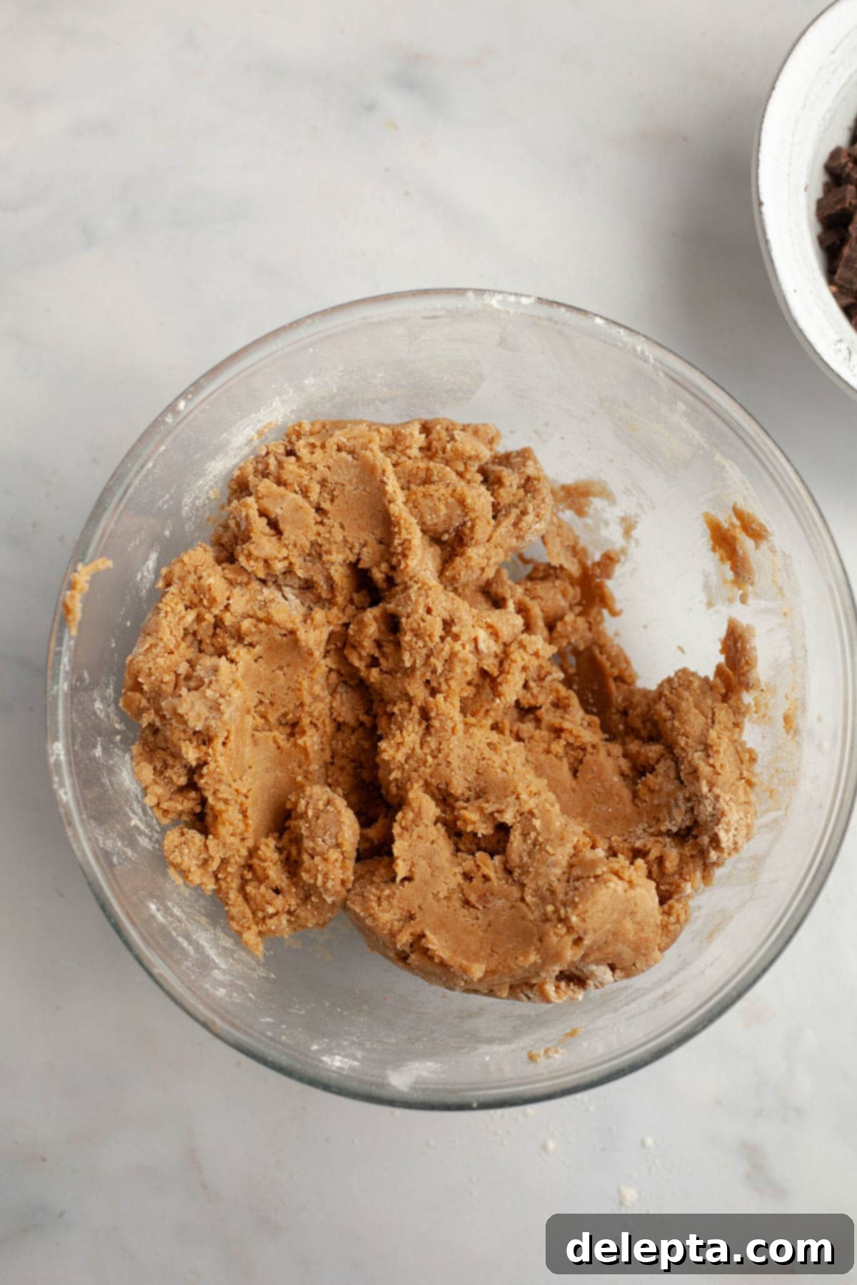 Decadent Espresso Infused Brown Butter Chocolate Cookies 7 Brown butter cookie dough in a glass bowl.