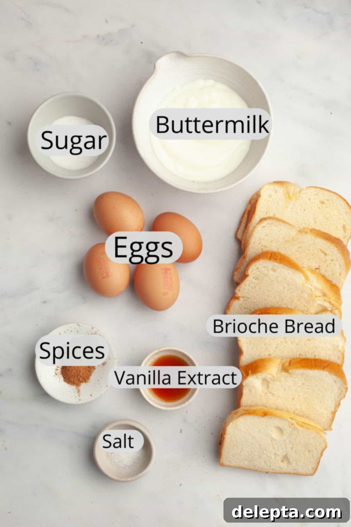 Effortless Buttermilk Brioche French Toast 3 All the fresh ingredients needed to make delicious buttermilk french toast, meticulously weighed out into small bowls, ready for preparation.