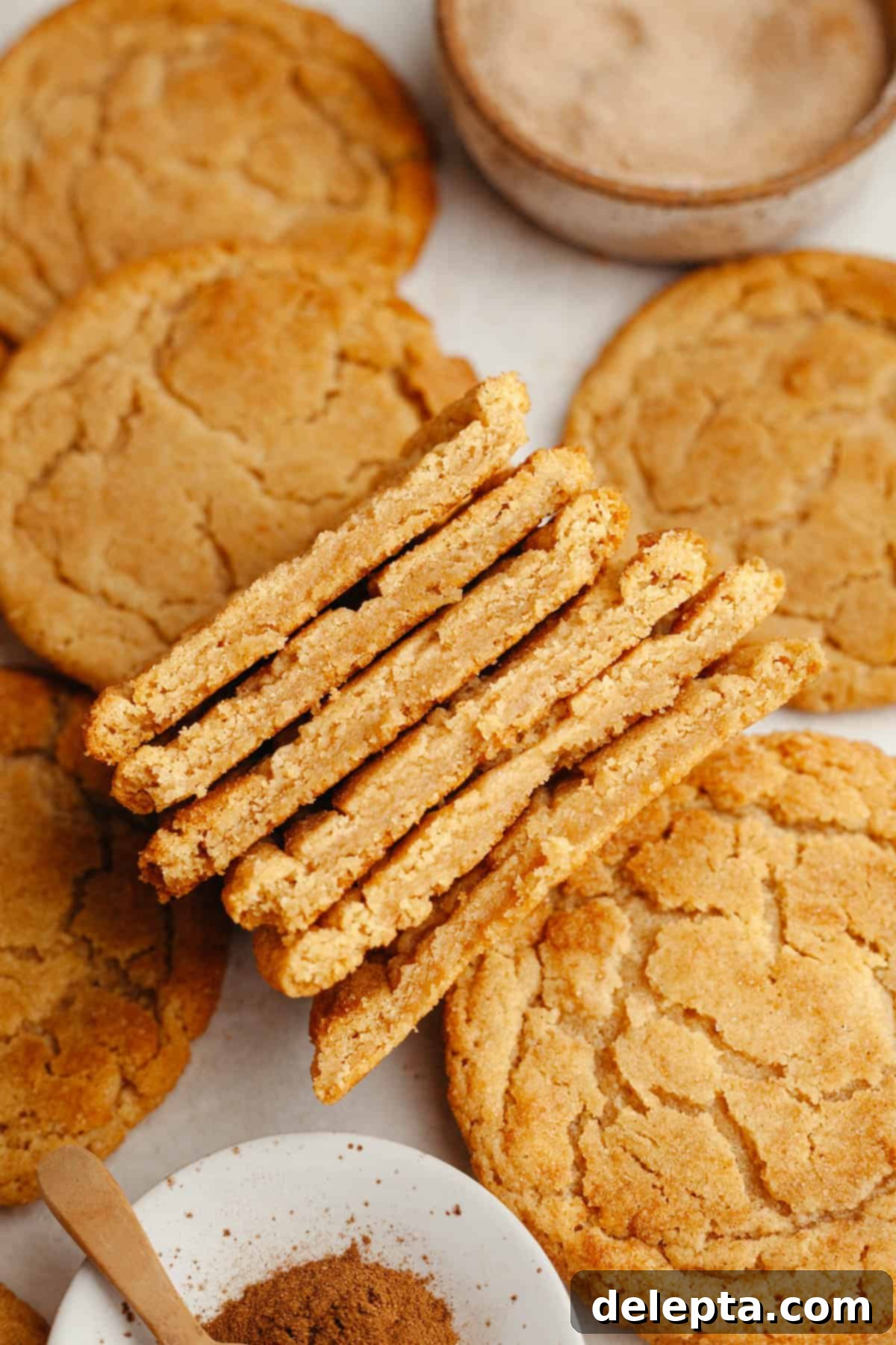 Peanut Butter Snickerdoodle Bliss 10 A delicious display of chewy peanut butter snickerdoodles, some cut in half to reveal their soft interior.