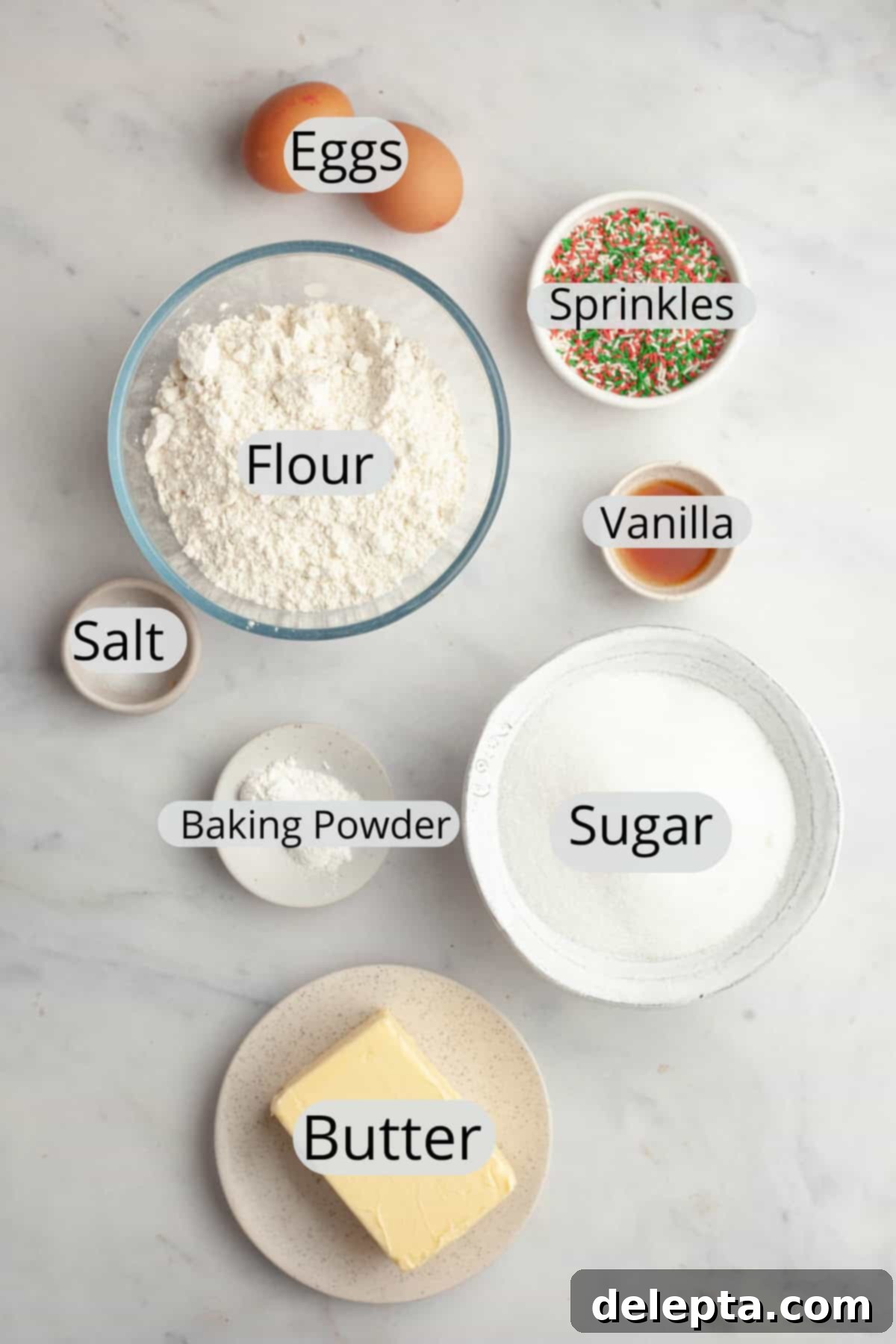 Melt-in-Your-Mouth Brown Butter Christmas Sprinkle Cookies 3 All the ingredients needed to make Christmas sprinkle sugar cookies, weighed out into small bowls, including butter, sugar, flour, eggs, and festive sprinkles.
