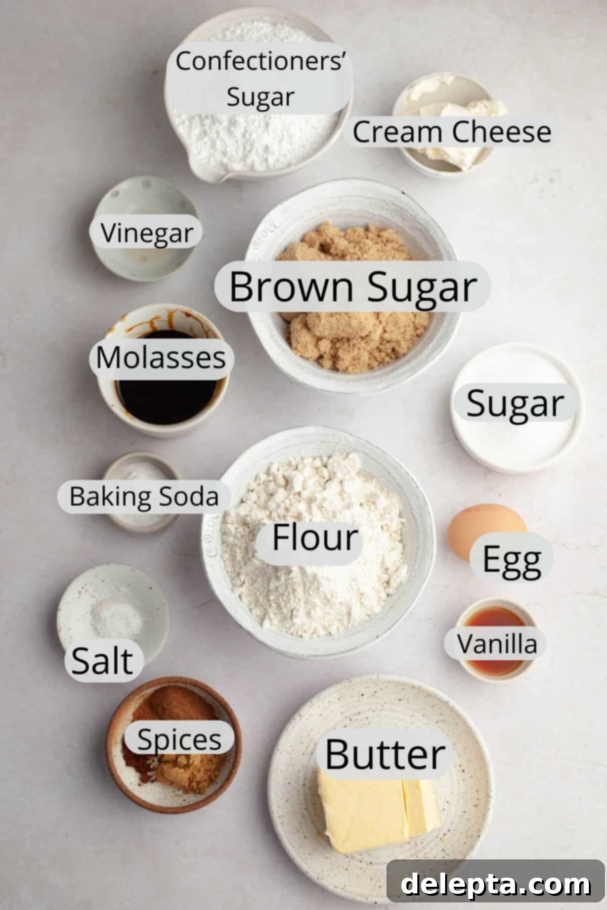 Velvet Gingerbread Cookies with Cream Cheese Frosting 3 All the pre-measured ingredients neatly laid out in small bowls for making frosted gingerbread cookies, ready for baking.