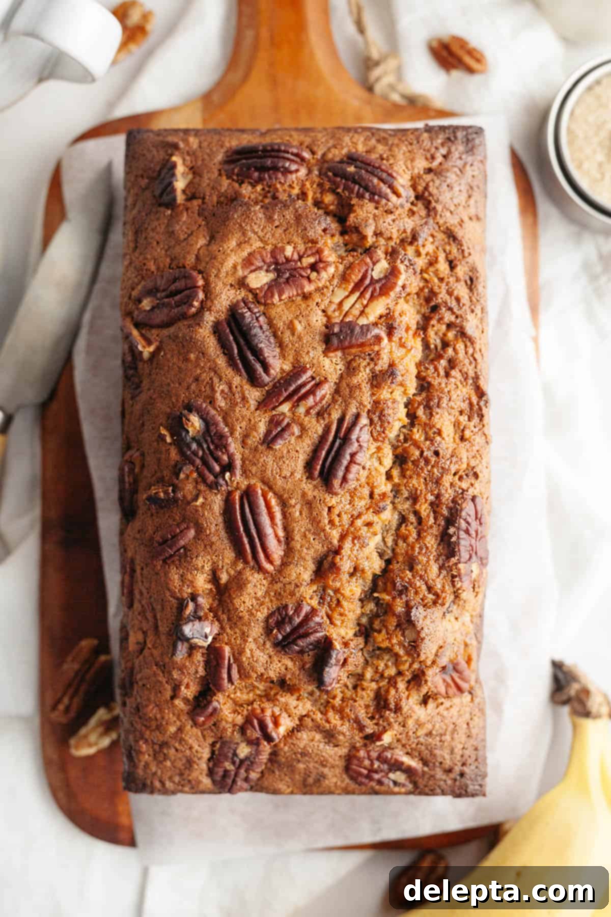 Decadent Brown Butter Cinnamon Pecan Banana Bread 9 Baked brown butter cinnamon pecan banana bread, golden brown and ready to slice.