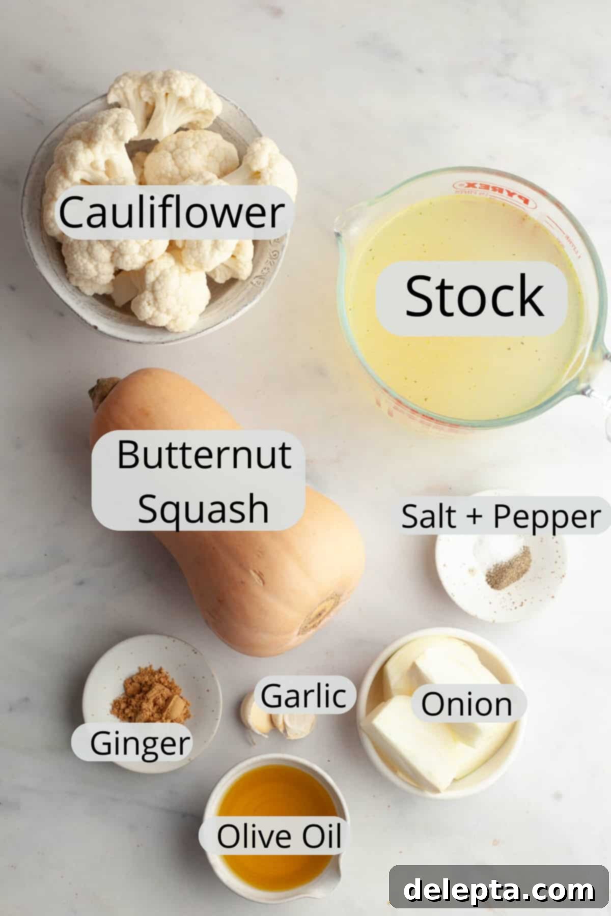 Velvety Roasted Butternut Cauliflower Soup 3 All the ingredients needed to make butternut squash cauliflower soup, neatly arranged in small bowls.