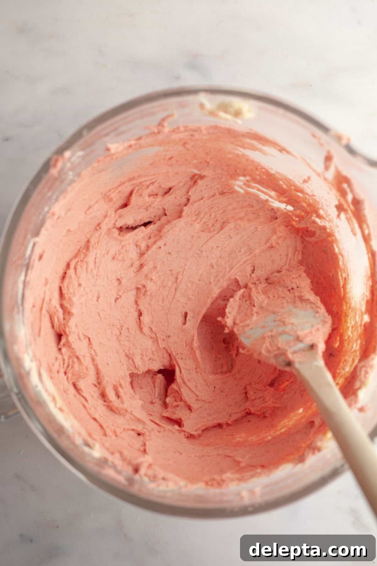 Decadent Chocolate Strawberry Dream Cake 11 Strawberry buttercream in a large glass bowl.